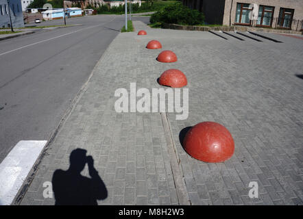 concrete hemispheres prohibiting parking barrier. The drive and the ...