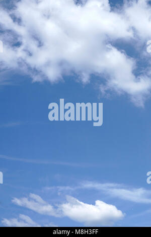 Cumulus humilis clouds in the blue sky, view from below Stock Photo