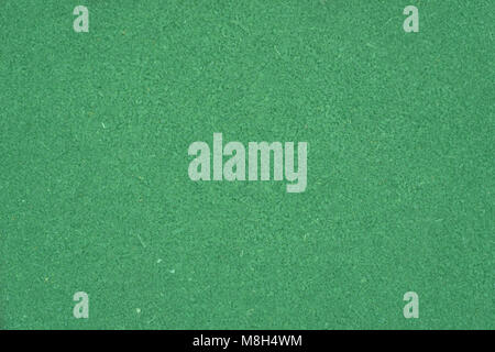 Natural grass texture pattern background of golf course turf lawn with world map from top view lawn in bright yellow green Stock Photo