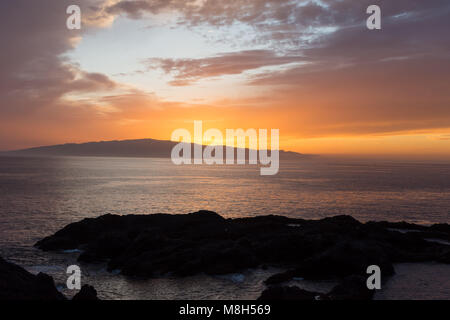 Sunset over La Gomera from the west coast of Tenerife Stock Photo