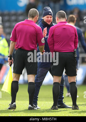 Tottenham Hotspur manager Mauricio Pochettino talks to the referee's at the end of the Emirates FA Cup, quarter final match at the Liberty Stadium, Swansea. Stock Photo