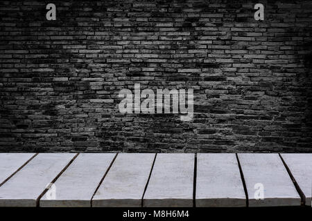 table empty The background is brick wall Empty top wooden shelves and stone wall background Stock Photo