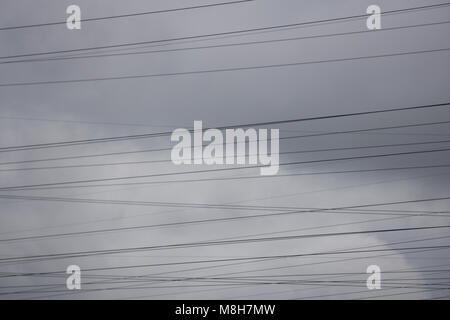Electric wire many cables on pole and disheveled. Electrical wiring Stock Photo