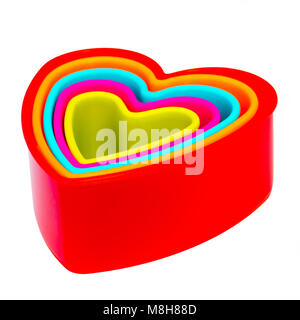 Cookie cutters stacked together in a set, cut out or isolated on a white background. Stock Photo