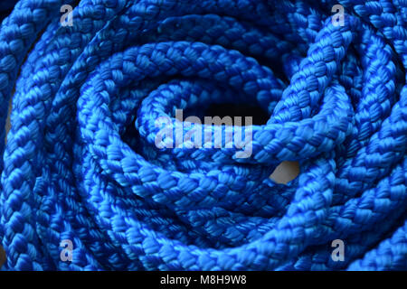 blue Plastic Rope on wooden Background Stock Photo