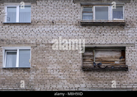 room in an old house with boarded up window Stock Photo
