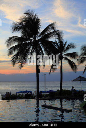 Thailand, Phuket, Kata Noi Beach, sunset, pool, palms, people, Stock Photo