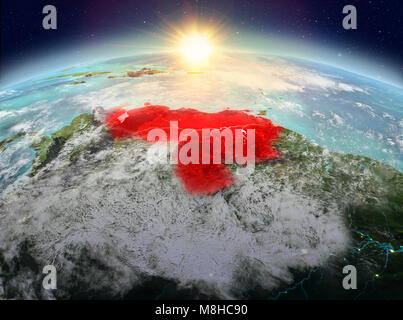 Satellite view of Venezuela highlighted in red on planet Earth with clouds during sunrise. 3D illustration. Elements of this image furnished by NASA. Stock Photo