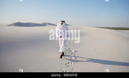Serious young Arabian UAE Sheikh businessman considering constru Stock Photo