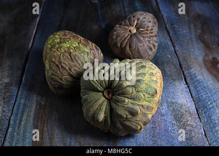 cherimoya fruits also known as custard apple on rustic background Stock Photo