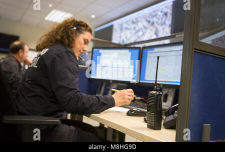 Police officers control the emergency calls from their control area inside main local police headquarter in palma de mallorca Stock Photo