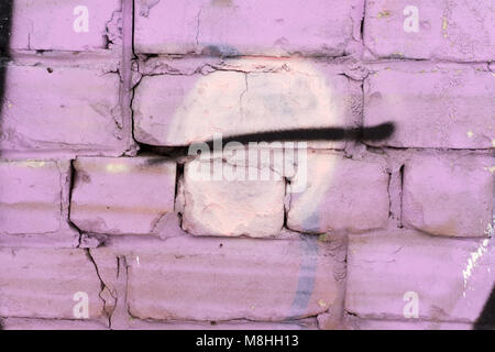 The wall is made of brick, painted in a pale pink color. Beautiful background. Empty place for inscriptions Stock Photo