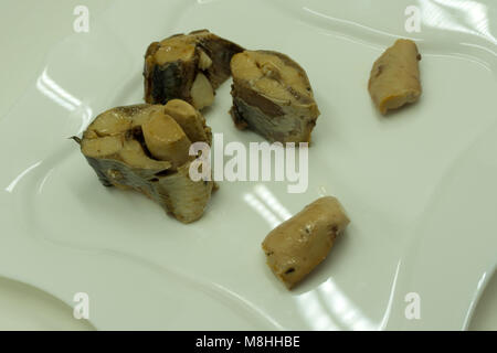 Sprats sandwiches on white plate Stock Photo