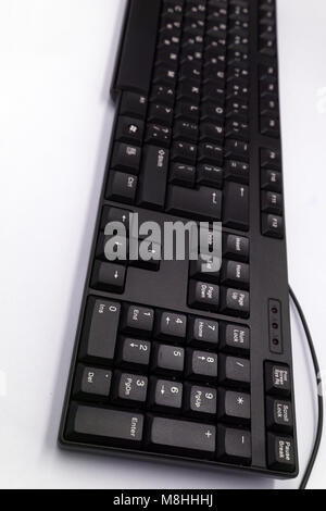 Top view of Full size wireless desktop computer keyboard isolated on white background with clipping path inside. Eng and empty alphabet Stock Photo
