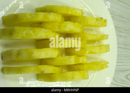 Isolated pineapple wedges. Two chunks of pineapple fruit isolated on white background with clipping path Stock Photo