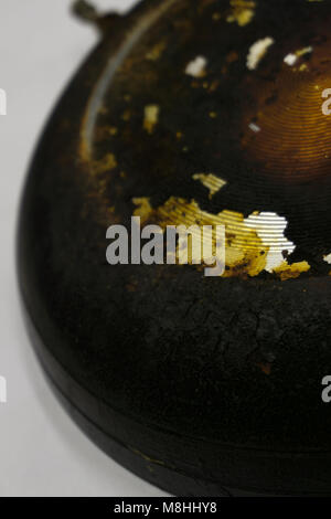 Broken old frying pan isolated on a white background Stock Photo