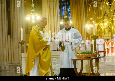 Armagh, Ireland, 17 Mar 2018. Archbishop Eamon Martin, left, blesses shamrock during St Patrick's Day Vigil Mass    St Patrick's Cathedral Armagh       16 March 2018     CREDIT: Liam McArdle Credit: Liam McArdle/Alamy Live News Stock Photo