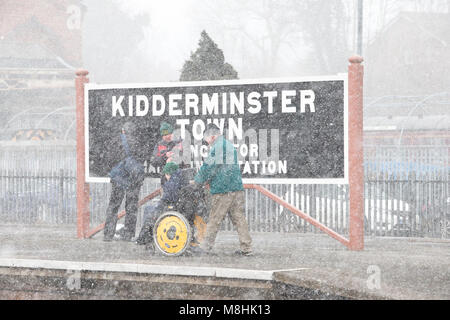 Kidderminster, UK. 17th March, 2018. UK weather: as the Severn Valley Railway celebrates a successful 'Spring Gala Weekend', train enthusiasts of experience blizzard conditions throughout the day. Despite strong, bitterly cold, easterly winds leading to a significant wind chill, nothing stops the railway enthusiasts from enjoying their trainspotting passion. Credit: Lee Hudson/Alamy live News Stock Photo