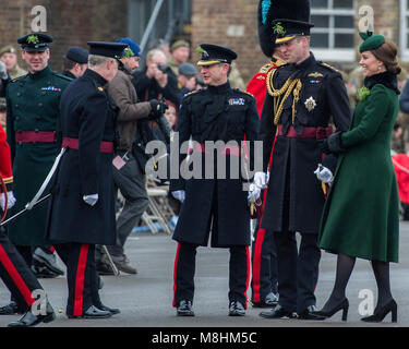 London, UK, 17 Mar 2018. The Duke of Cambridge, Colonel of the Irish Guards, accompanied by The Duchess of Cambridge, visited the 1st Battalion Irish Guards at their St. Patrick's Day Parade. 350 soldiers marched onto the Parade Square at Cavalry Barracks led by their mascot, the Irish Wolfhound Domhnall. Her Royal Highness presented the shamrock to Officers and Warrant Officers, who in turn issued it along the ranks. The parade concluded with a march-past during which His Royal Highness Prince William took the salute. Stock Photo