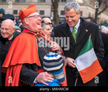 New York, USA, 17 Mar 2018.  Archbishop of New York Cardinal  Timothy Dolan laughs next to New York City Mayor Bill De Blasio  in front of St. Patrick's cathedral during the traditional St. Patrick's Day Parade. Photo by Enrique Shore/Alamy Live News Stock Photo