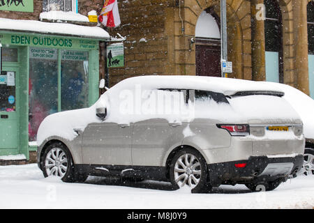 Kikby Stephen, Cumbria.  Uk Weather. 18th March, 2018.  Bitterly cold winds and heavy snow showers. Beast from the East 2' to cover the country in sleet and snow with more Siberian weather on the way bringing hardship and hunger to farm animals in remote locations. Credit: MediaWorldImages/AlamyLiveNews Stock Photo