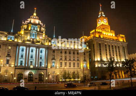 The former Hong Kong & Shanghai Bank and Custom House buildings on Shanghai’s historic Bund seen at night from the waterfront promenade. Stock Photo