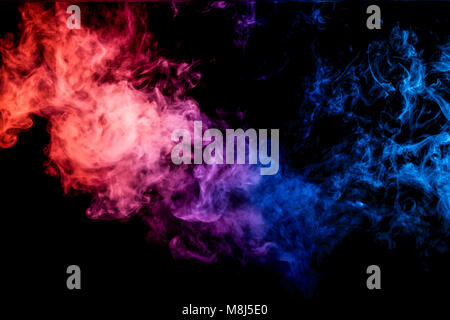 Dense multicolored smoke of pink, blue and purple colors on a black isolated background. Background of smoke vape Stock Photo