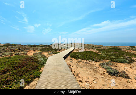 Wooden paths and observation decks on summer Atlantic rocky coast (Costa Vicentina, Algarve, Portugal). Stock Photo