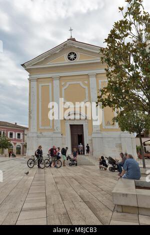POREC, CROATIA - SEPTEMBER 21, 2017: People visit Church of Our Lady of Angels on Freedom Square. Porec is a town almost 2,000 years old and municipal Stock Photo