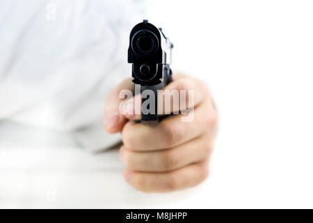 black pistol in a hand on white background Stock Photo