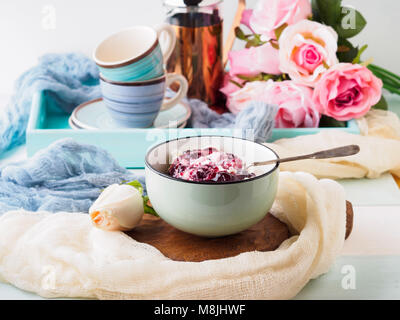 Bowl of yogurt and quark with berry sauce jam. Morning breakfast Stock Photo