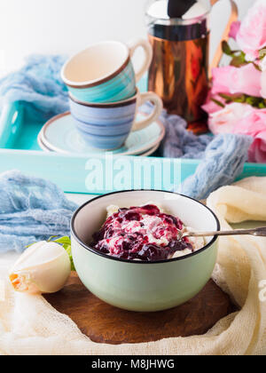 Bowl of yogurt and quark with berry sauce jam. Morning breakfast Stock Photo