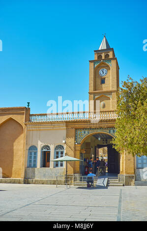 ISFAHAN, IRAN - OCTOBER 20,2017: The old clock tower decorates the entrance gate of Vank Cathedral in Julfa neighborhood, on October 20 in Isfahan. Stock Photo