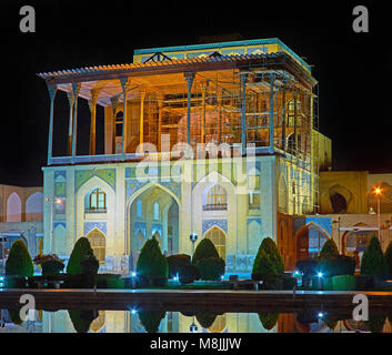 The late evening is the perfect time to enjoy the beauty of medieval landmarks of Isfahan in bright lights, Iran. Stock Photo