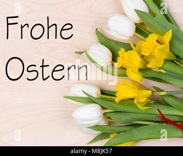 german inscription merry easter holiday on wooden background Stock Photo