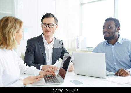 Discussing financial statistics Stock Photo