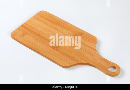 wooden cutting board with handle on white background Stock Photo
