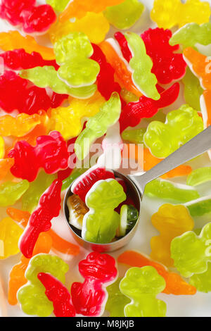 scoop of colorful gummy candies in the shape of animals Stock Photo
