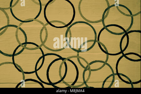 Interlocking circles pattern on light brown painted wood panel background Stock Photo