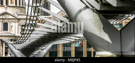 The skeletal underbelly of Norman Foster's iconic London Millennium Footbridge tautly connecting Bankside with the City of London Stock Photo