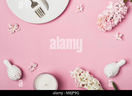 Spring Pink flat lay. White Table setting and hyacinths flowers. Stock Photo