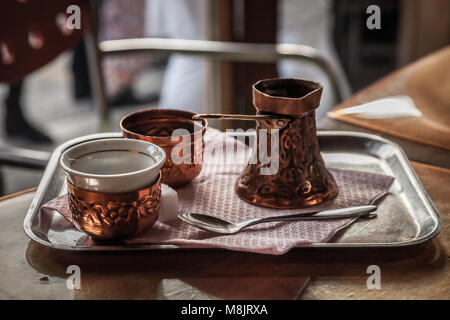 Bosnian Coffee Pot, also known as Dzezva, taken in a Sarajevo Cafe. A Dzezva, or cezve is a pot designed specifically to make Turkish or Bosnian coffe Stock Photo