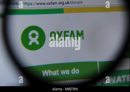 The Oxfam website seen through a magnifying glass Stock Photo