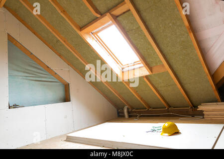 House attic under construction mansard wall insulation with rock wool Stock Photo