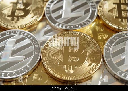 Golden bitcoins and silver litecoins Stock Photo