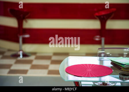 Table at gym waiting area with bar in background Stock Photo