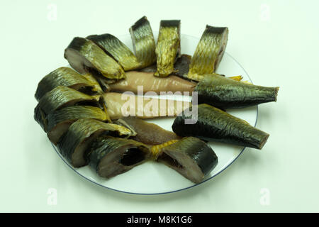 Pieces of salt cod fish isolated on a white studio background Stock Photo