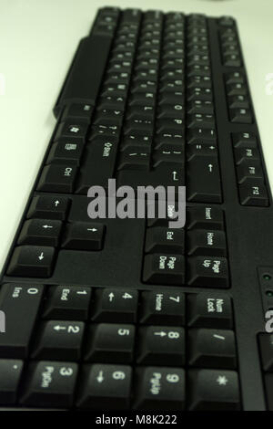 A plastic keyboard against a white background Stock Photo