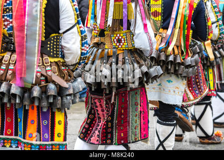 People in traditional carnival kuker costumes at Kukeri festival kukerlandia Yambol, Bulgaria Stock Photo