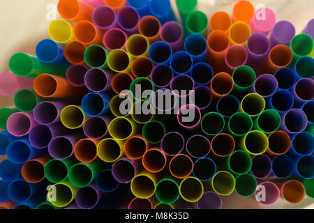 colored flexible straws in the glass isolated on white background Stock Photo